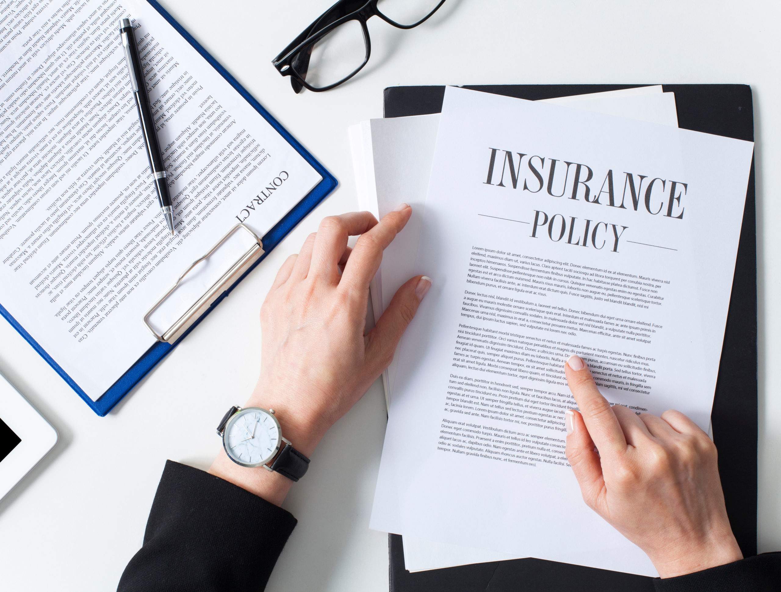 mgrm-insurance-examining-policy-2-scaled